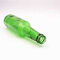 green color glass beer bottle